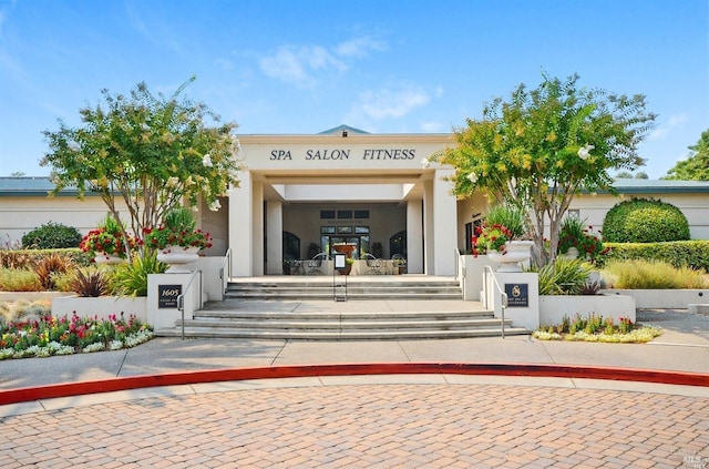 property entrance with stucco siding