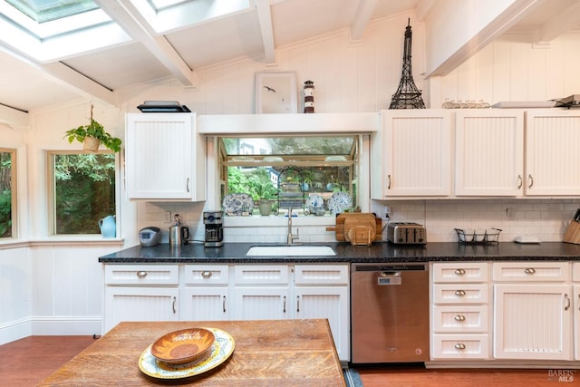 kitchen with backsplash, stainless steel dishwasher, dark wood-type flooring, sink, and white cabinets