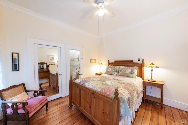 bedroom featuring connected bathroom, ceiling fan, ornamental molding, and light wood-type flooring