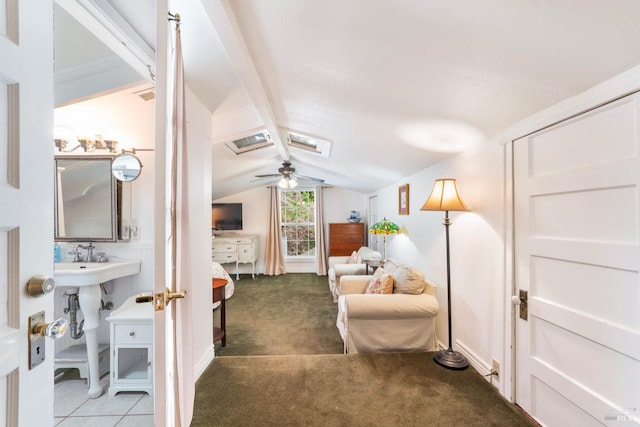 carpeted bedroom featuring vaulted ceiling with beams and ceiling fan