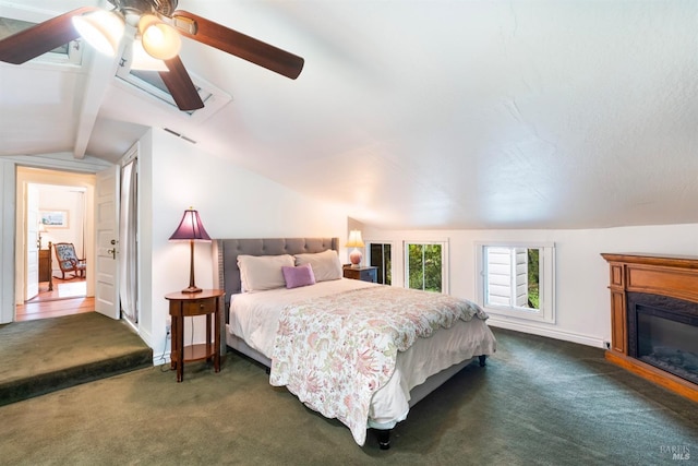 bedroom with ceiling fan, lofted ceiling with beams, and dark colored carpet