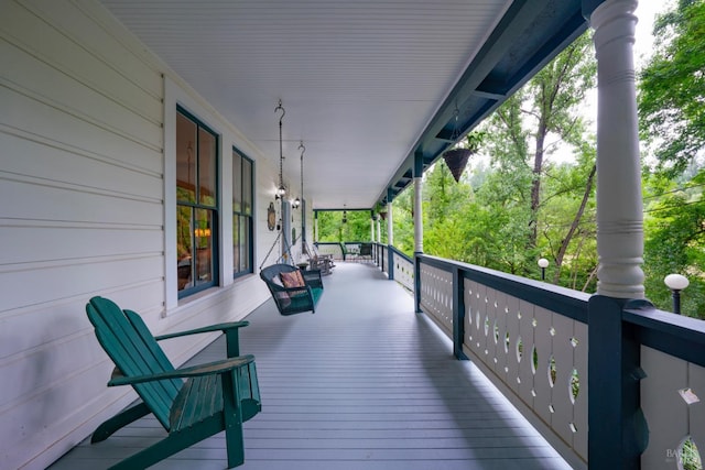 wooden terrace featuring covered porch