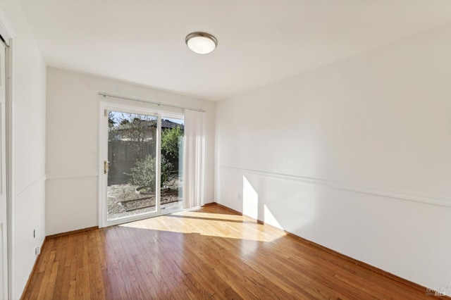 empty room featuring wood-type flooring