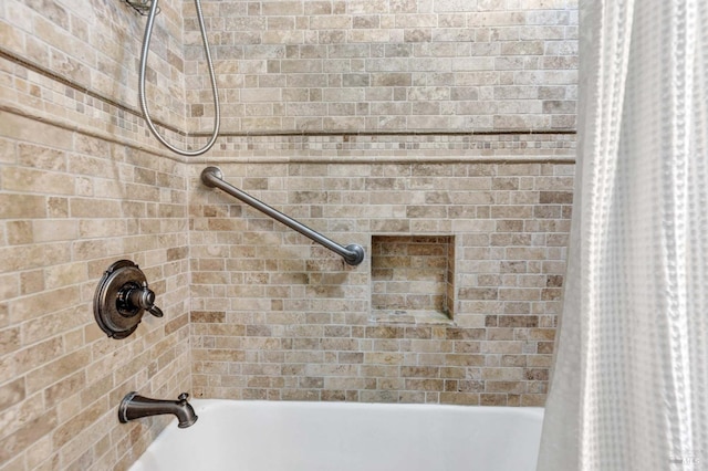 interior details featuring shower / bathtub combination with curtain