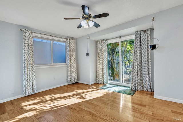 empty room featuring light hardwood / wood-style floors and ceiling fan