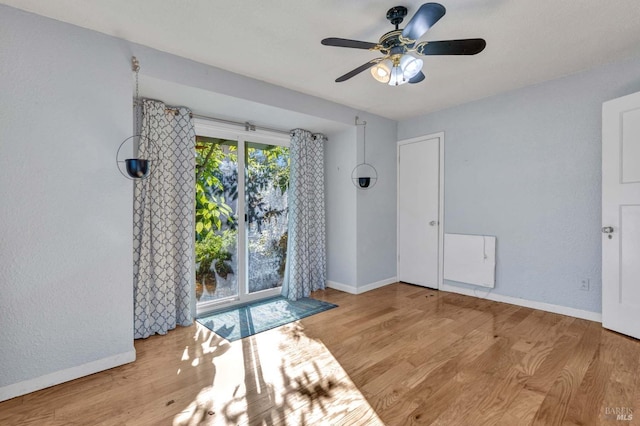 unfurnished room featuring light hardwood / wood-style flooring and ceiling fan