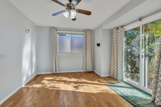 unfurnished room with ceiling fan and light wood-type flooring