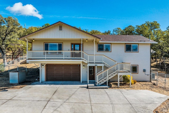 19316 N Shore Ct, Hidden Valley Lake, CA 95467 - view of front of property with stairway, driveway, fence, a porch, and a garage