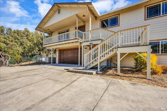 view of front of home with a porch and a garage