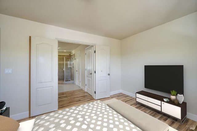 bedroom with hardwood / wood-style flooring