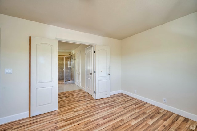 unfurnished room with light hardwood / wood-style flooring