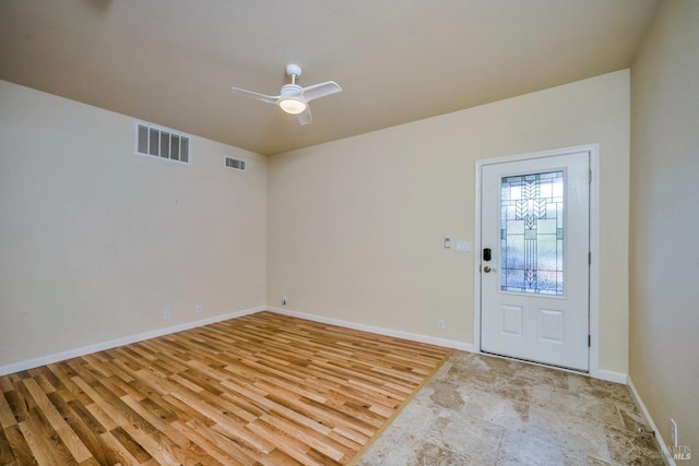 entrance foyer with ceiling fan and light hardwood / wood-style floors