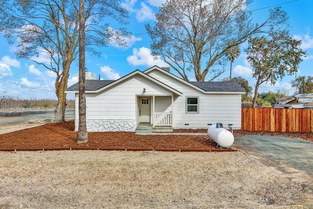 bungalow featuring crawl space and fence