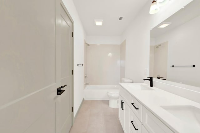 full bath featuring tile patterned flooring, toilet, a sink, double vanity, and washtub / shower combination