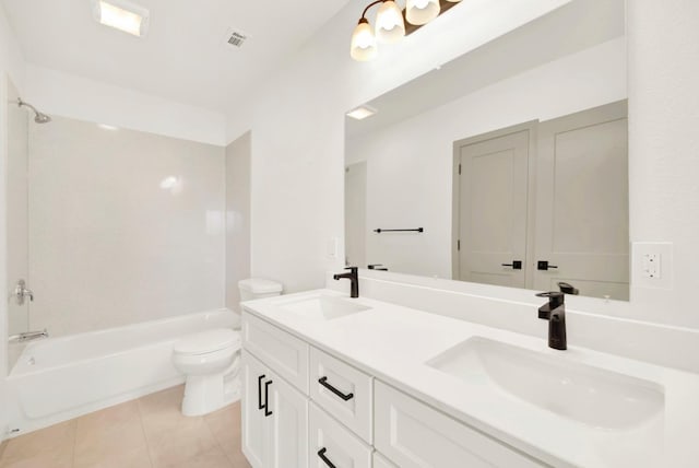 full bath with toilet, tile patterned flooring, a sink, and bathing tub / shower combination