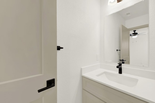 bathroom with visible vents and vanity