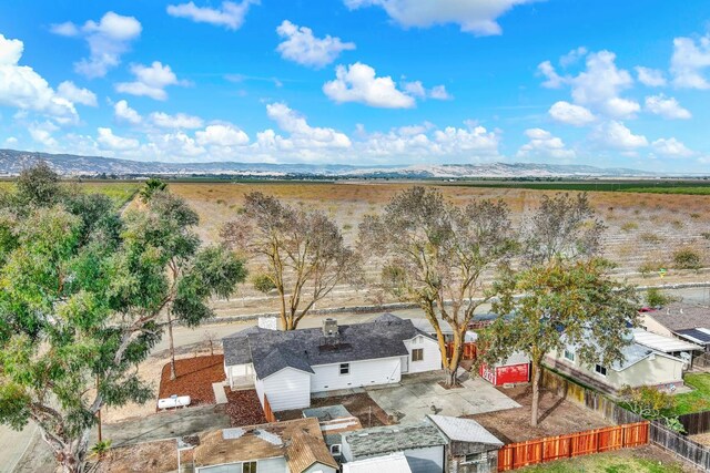 birds eye view of property with a mountain view