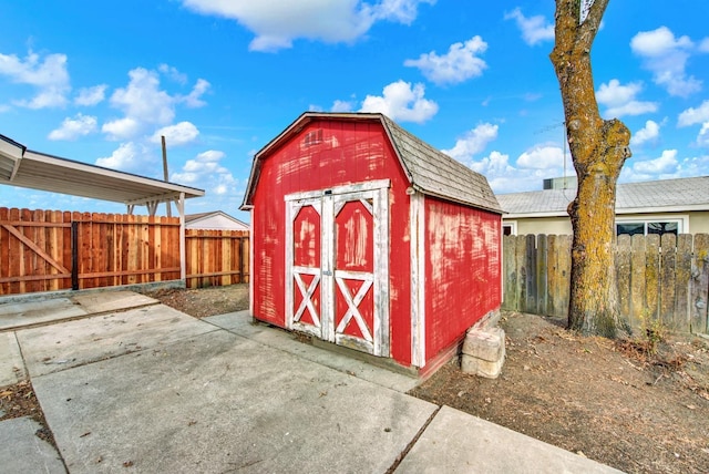 view of shed featuring a fenced backyard