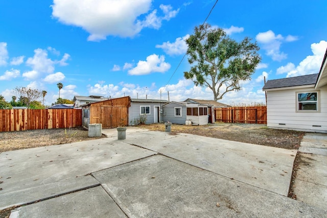 back of property with a patio