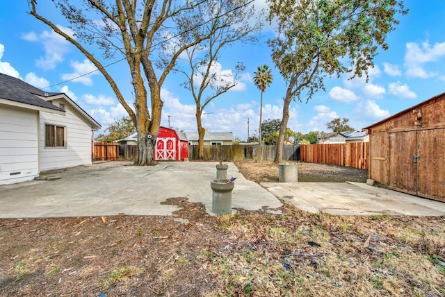 view of yard with a patio and an outdoor structure