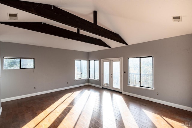 unfurnished room featuring dark wood-type flooring, lofted ceiling with beams, and french doors