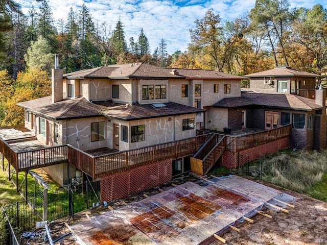 back of house featuring a deck