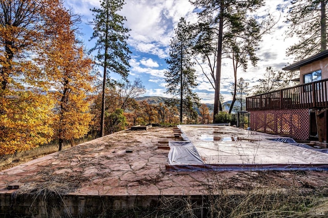 view of patio / terrace featuring a deck with mountain view