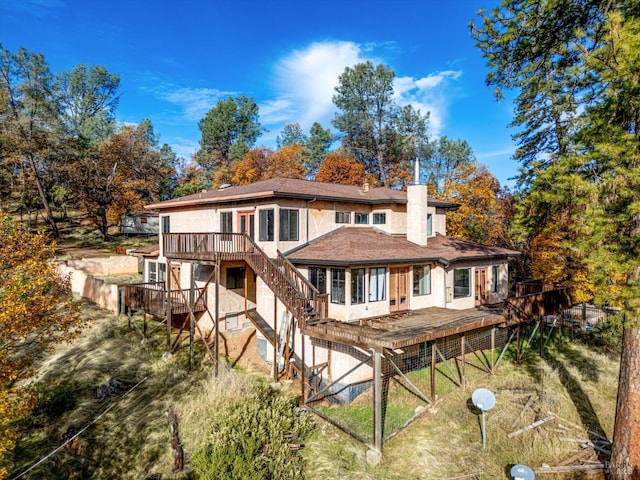 rear view of house with a wooden deck