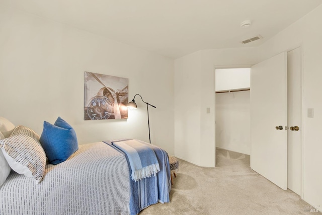 carpeted bedroom featuring a closet