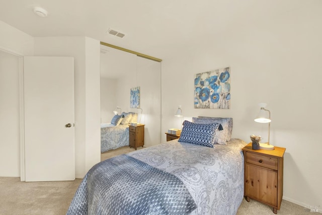 carpeted bedroom with a closet