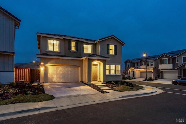 front facade with a garage