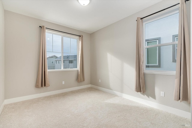 interior space with stairway, light tile patterned floors, a healthy amount of sunlight, and baseboards