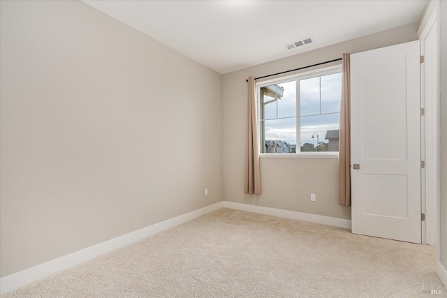 unfurnished bedroom featuring baseboards, visible vents, carpet floors, and a closet