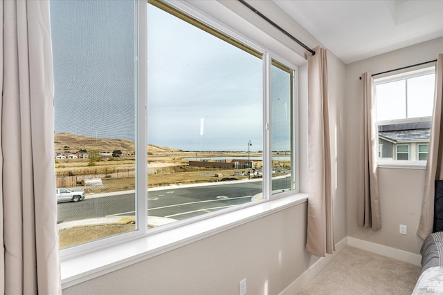 spare room featuring visible vents, baseboards, and carpet