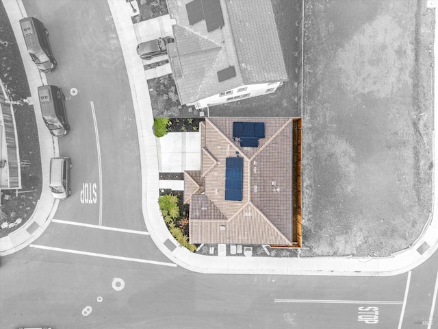 view of front of home featuring stucco siding, a garage, concrete driveway, and fence