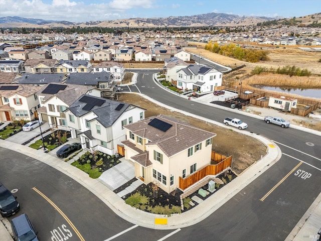 birds eye view of property featuring a mountain view