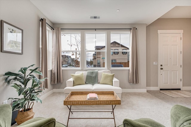 living room with recessed lighting, visible vents, and baseboards