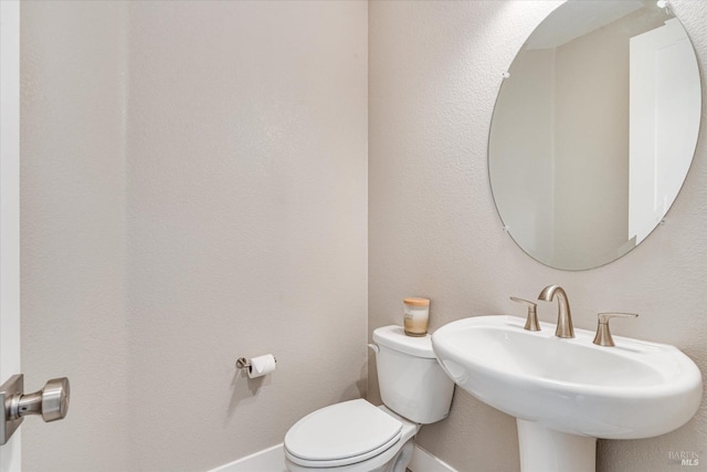 bathroom with sink and toilet