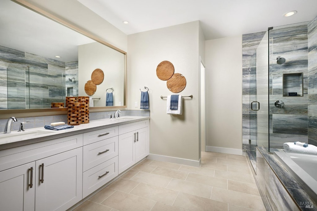 bathroom with vanity, tile patterned floors, and separate shower and tub