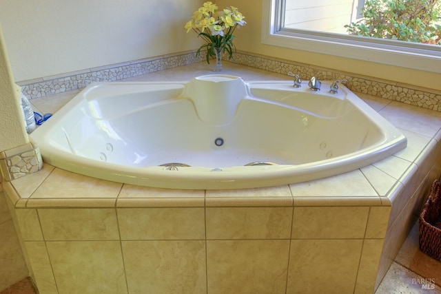 bathroom with tiled tub