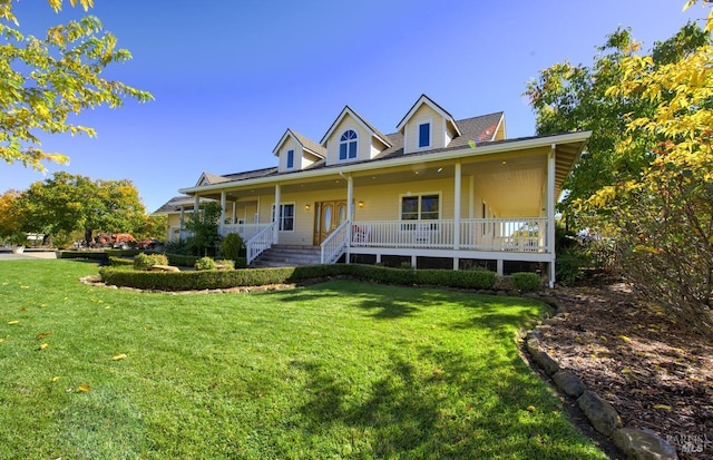 view of front of house with a porch and a front lawn