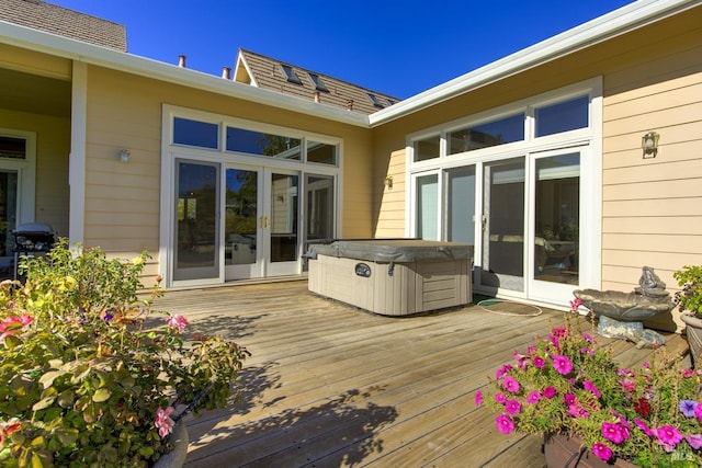 deck featuring area for grilling and a hot tub