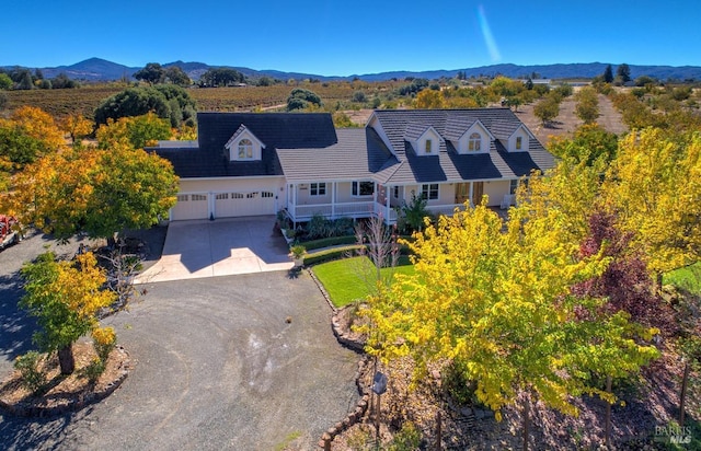 birds eye view of property featuring a mountain view