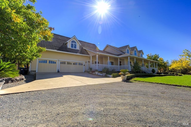 view of front of property with a garage and a porch