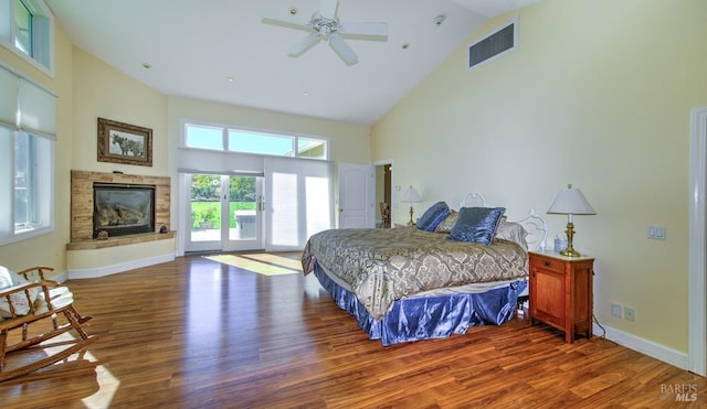 bedroom with hardwood / wood-style flooring, access to outside, high vaulted ceiling, and ceiling fan