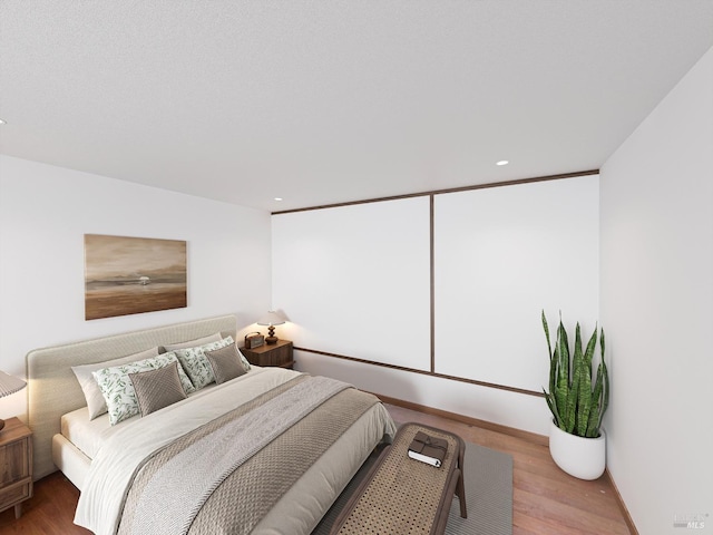 bedroom with wood-type flooring