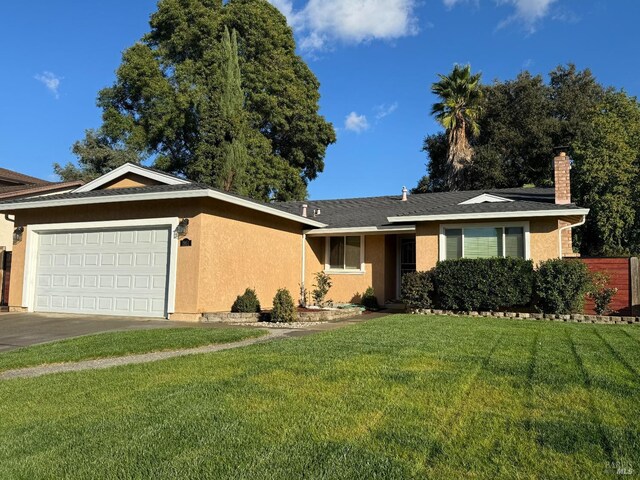 single story home with a front lawn and a garage