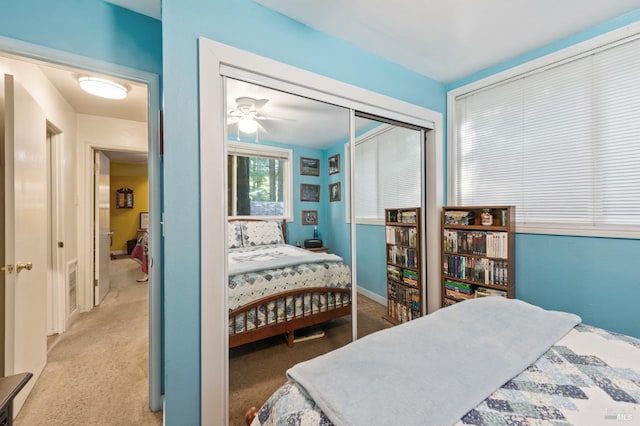 bedroom with carpet floors, a closet, and visible vents