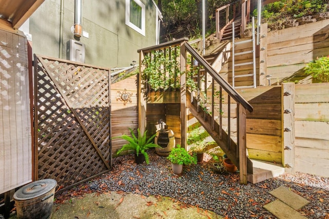 exterior space featuring stairway and fence