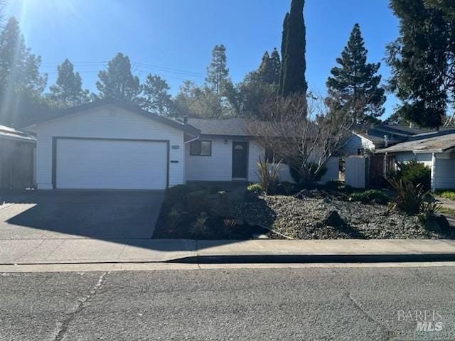 single story home featuring a garage